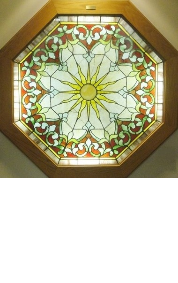 Stained glass flower in a wooden octagon frame